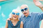 Senior couple in wacky sunglasses