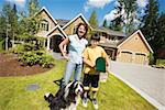 Mom with son and dog outside house