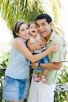 Playful parents with little girl