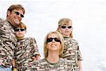 Family wearing matching camouflage shirts