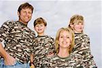Portrait of family in camouflage shirts