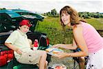 Mother and son with picnic food