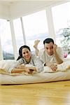 Couple watching television at home