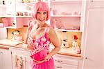 Woman with pink hair in pink kitchen