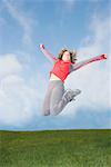 Happy woman jumping in midair