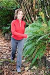 Woman jogging on forest path