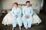 Overweight couple in matching pajamas