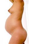 Profile of nude pregnant woman