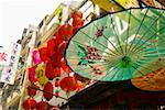 Parasols and lanterns hanging outside Hong Kong shop