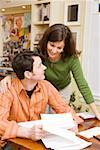 Portrait of couple doing paperwork at home