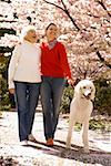 Two women walking dog