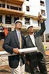 Two businessmen at construction site