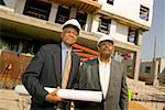 Portrait of two businessmen at construction site