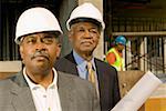 Close up portrait of businessmen at construction site