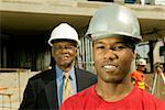 Portrait of construction worker and businessman