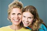 Close up portrait of woman with teenage daughter