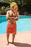 Man wearing towel turban by pool