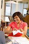 Woman happily tearing mail