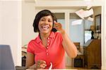 Woman throwing torn mail in celebration