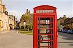 Red telephone booth in town, Cotswolds, United Kingdom