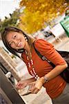 Woman smiling and using ATM