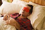 Man sleeping with eye mask