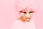 Woman wearing pink wig and eyeglasses