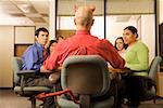 Businessman with devil horns and tail at meeting
