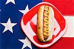 Hot dog sitting on American flag tablecloth