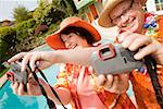 Couple wearing festive outfits taking self portraits