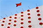 Lanterns and flag on department store for Chinese Lunar New Year, Beijing, China