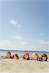 Group of children in sand at beach