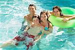 Family in swimming pool