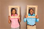 African couple looking through picture frames