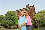African couple in front of new house