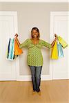 African woman holding shopping bags