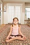 Girl meditating on floor
