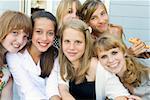 Group of teenaged girls hugging