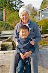 Grandmother hugging Asian grandson