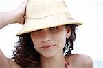 Female young adult wearing sun hat on the beach