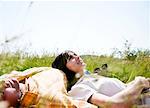 Man and woman lying in grass