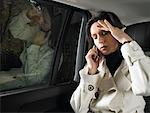 Woman in car, on the phone
