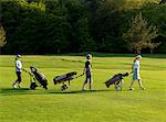 Three women on a golf fairway