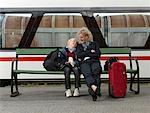 Grandmother and grandson on train station