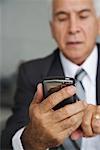 Businessman using Electronic Organizer