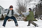 Father and Son Having Snowball Fight