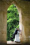 Groom Kissing Bride in Building Opening, Chamonix, Haute-Savoie, France