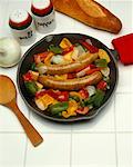 Sausages with Onion and Peppers in a Cast Iron Skillet