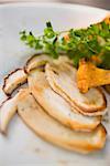 Fried cep slices and chanterelle with parsley