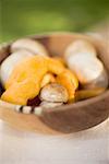 Chanterelles and ceps in wooden bowl